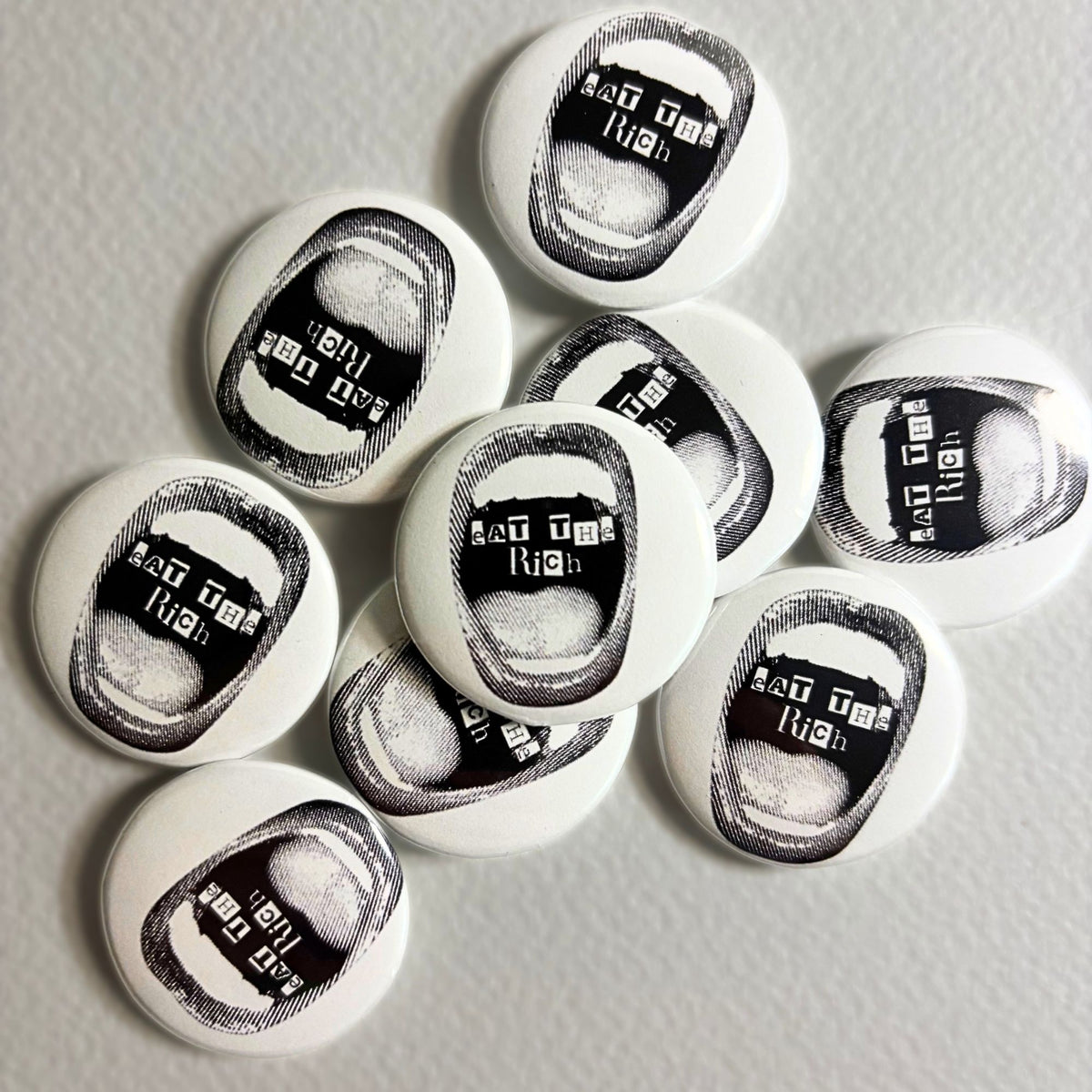 eat the rich pin