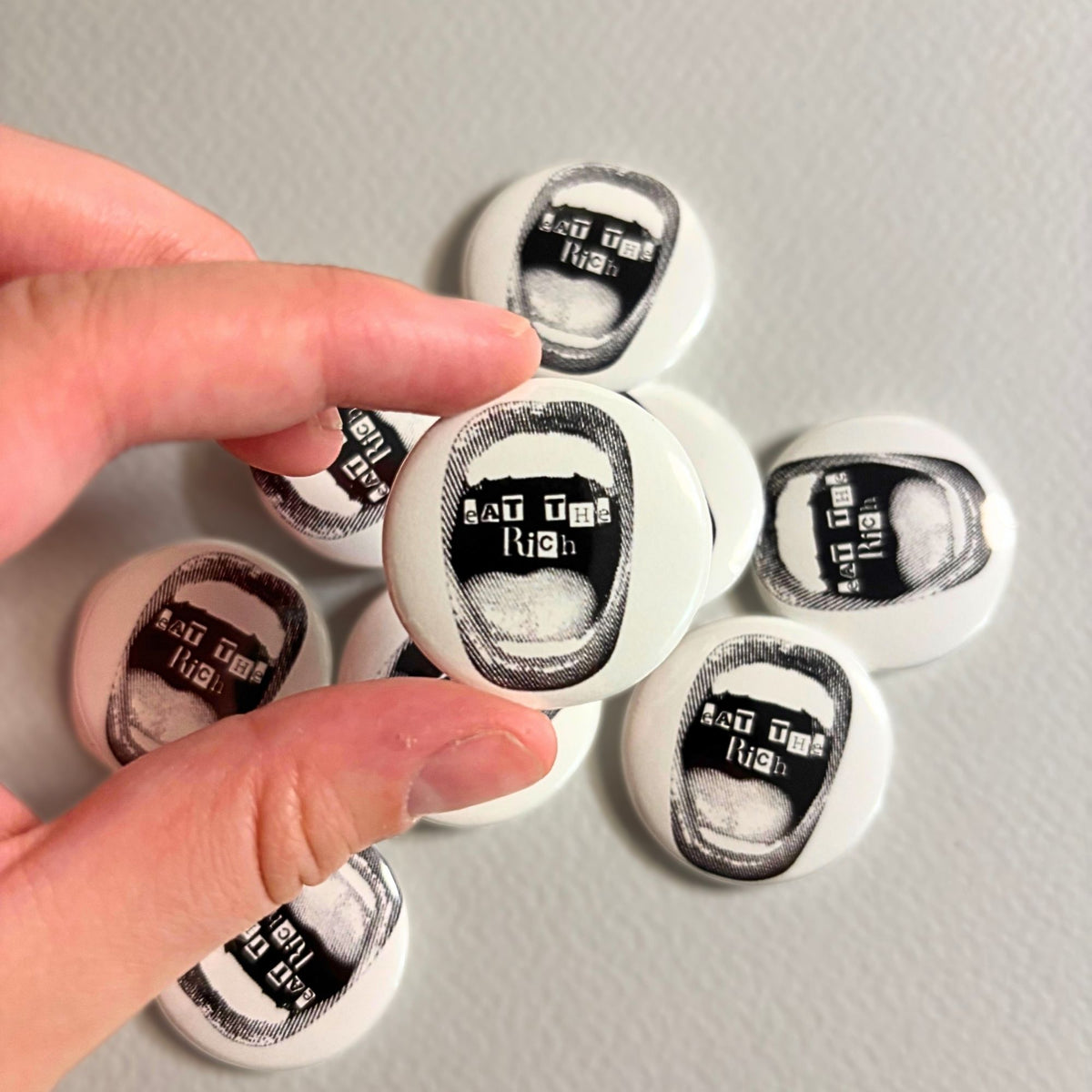 eat the rich pin
